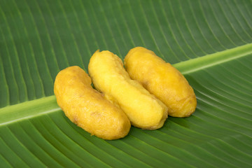 Fried banana fritters on banana leaf