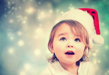 Happy Toddler girl with Santa hat