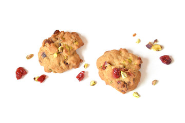Homemade cranberry and pistachio cookies on white background