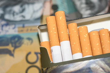 Expensive packet of cigarettes infront of Australian money.