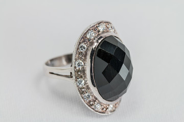 Old silver ring with black colored precious stone.