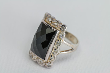Old silver ring with black colored precious stone.
