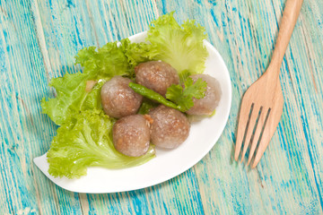 Tapioca Balls with Pork Filling and Paprika on Lettuce