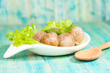 Tapioca Balls with Pork Filling and Paprika on Lettuce