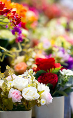 Close up of colorful artificial flowers.