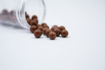herbal medicine pills on white background