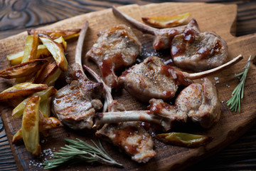 Close-up of grilled bobby veal rack steaks served with sauce