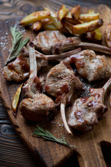 Grilled bobby veal rack steaks with fries, studio shot, close-up