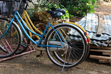 Fototapeta na wymiar Two Bicycles Parked On The Ground