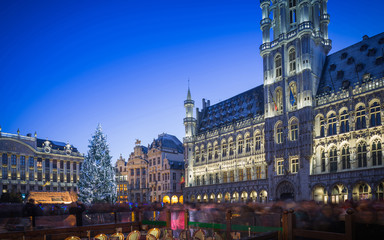 Lights show in Grand Place of Brussels Belgium and a huge Christmas tree with a crowd of...