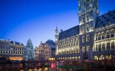Poster Lights show in Grand Place of Brussels Belgium and a huge Christmas tree with a crowd of unidentified people enjoying the celebration atmosphere   © ANADMAN