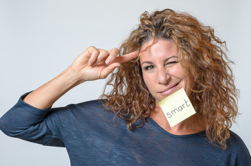 young woman with a sticky note in her face