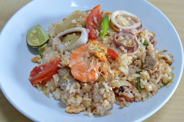 fried rice with seafood and egg on dish