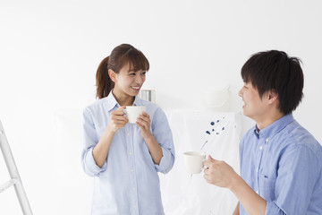 Young couple has a break with a cup of coffee
