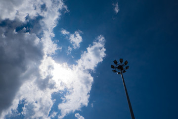 A Light Pole in Cloudy Sky