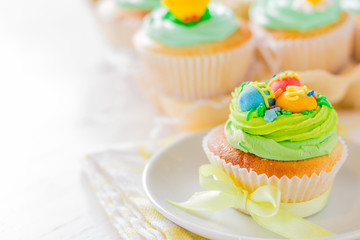 Easter cupcakes on white wood background