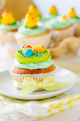 Easter cupcakes on white wood background