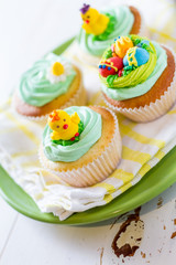 Easter cupcakes on white wood background