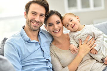 Obraz premium Portrait of happy young family of three