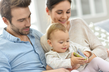 Obraz premium Portrait of happy young family of three