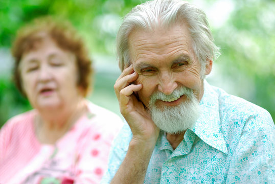 Elderly Woman Tells A Joke To The Husband