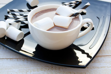 white cup with cocoa and marshmallows