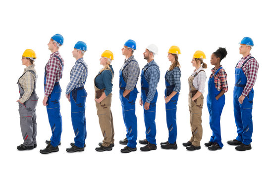 Side View Of Carpenters Standing In Line