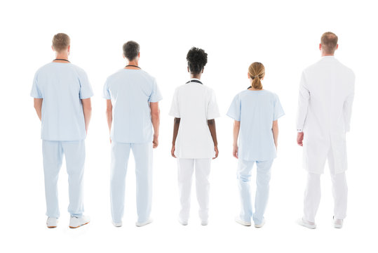 Medical Team Standing Against White Background