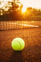 Zelfklevend Fotobehang Tennis ball/Close up of tennis ball on clay court. © likoper