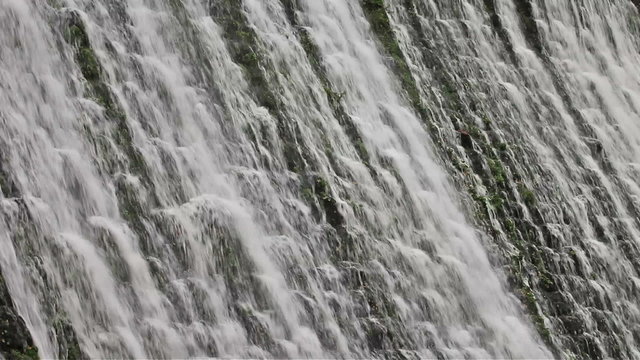 Water cascade on river dam