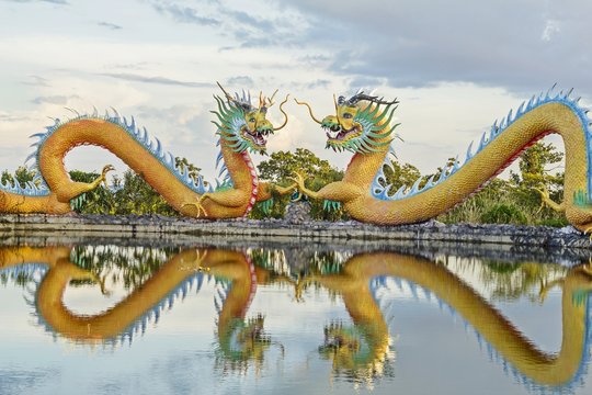 Colorful twins dragon statue with beautifully blue sky at public park 