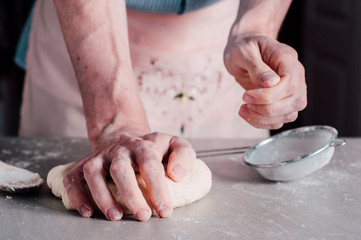 Man making dough for pizza