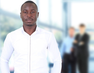 Happy black business man with people in the background