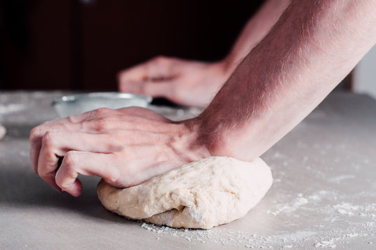 Man making dough for pizza