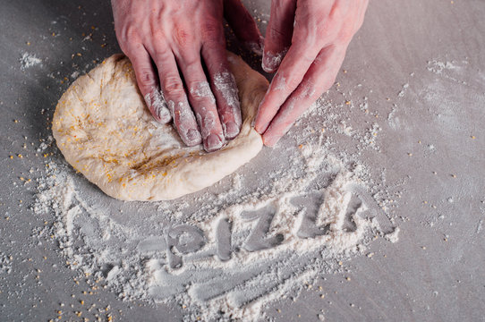 Man making dough for pizza