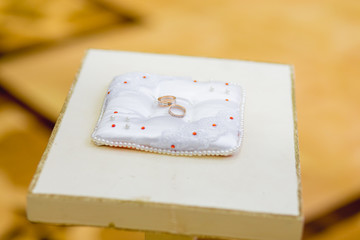 Wedding rings on a pillow