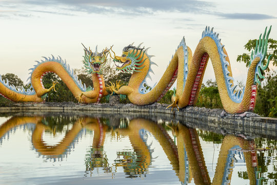 Colorful twins dragon statue with beautifully blue sky at public park 
