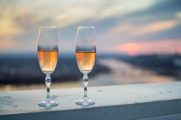 Glasses with champers at sunset