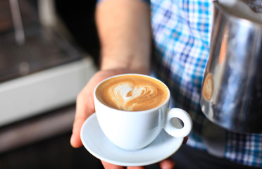 how to make latte art by barista focus in milk and coffee