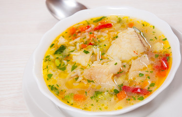 Fish soup with vegetables and rice