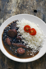 Brazilian feijoada with rice