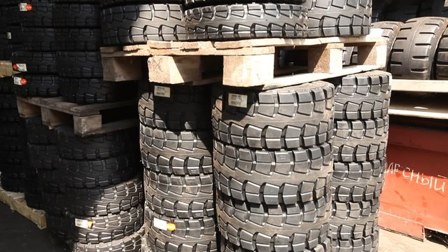Rubber tyre storage warehouse for electric forklifts and industrial machinery.