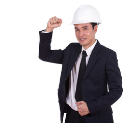 Happy young engineer celebrating with arm raised, concept of suc