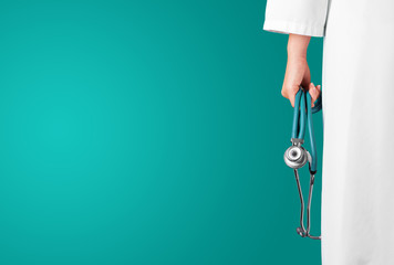 Green medical background with female doctor