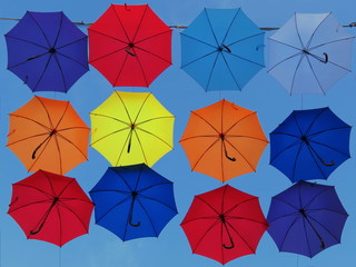 Colorful umbrellas with sky in background