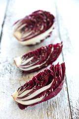 Delicious red chicory salad on a wooden background