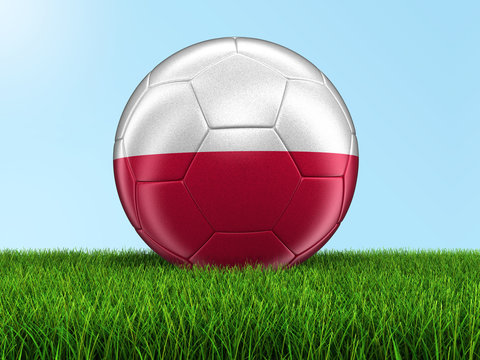 Soccer football with Polish flag on grass. Image with clipping path