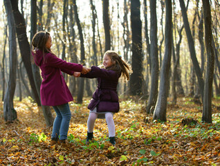 Kids playing in autumn