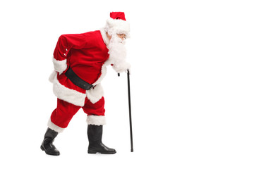 Santa Claus walking with a cane