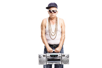 Mature rapper holding a ghetto blaster